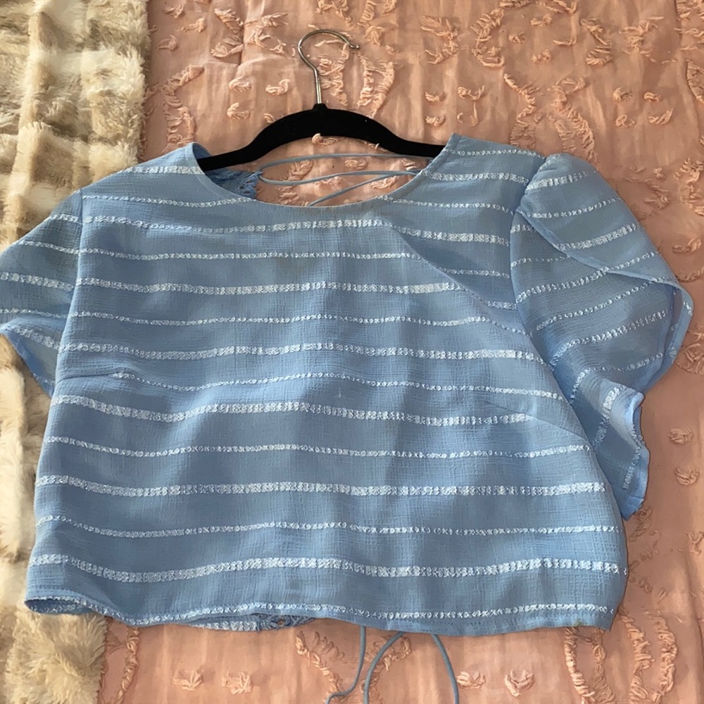 it is a large top and small bottom. The top runs small could fit a medium.